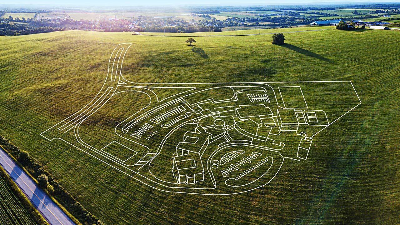 2D drawing of a Tetra Tech master plan for a wastewater treatment overlaying an aerial photo of a field